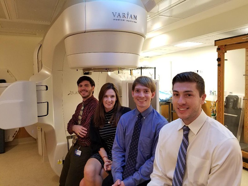 Matt Shelin (far right) joins his three classmates inside one of the Varian TrueBeam vaults at Bodine. Also pictured are (right to left) Alex Bredikin, Alexis Bowers, and Andrew Jaffe.